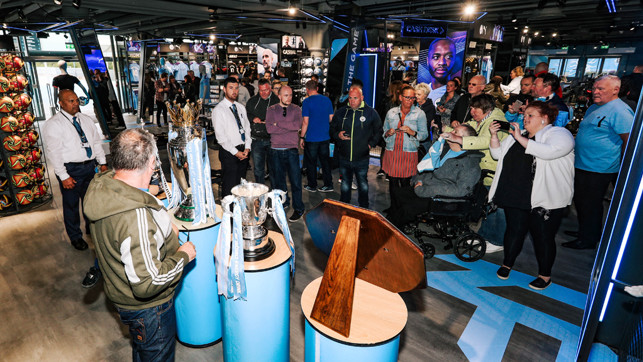 PICTURE PERFECT: Our fans were eager to check out the new-look store as well as being pictured with our trophies