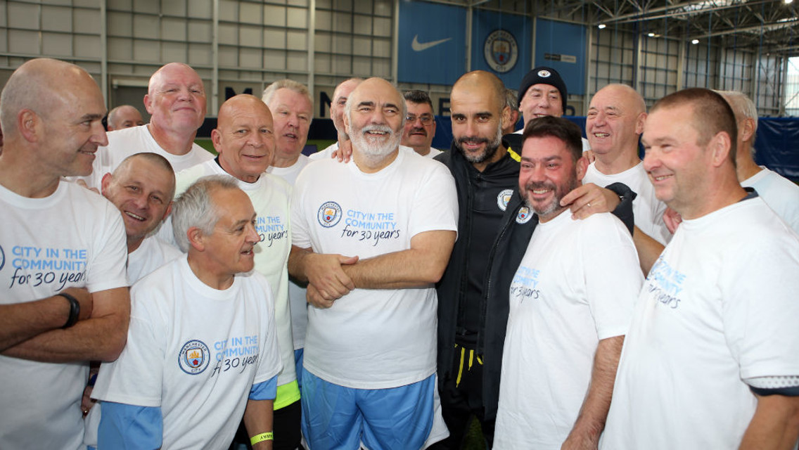 WALKING FOOTBALL: Man City manager Pep Guardiola with the walking football players