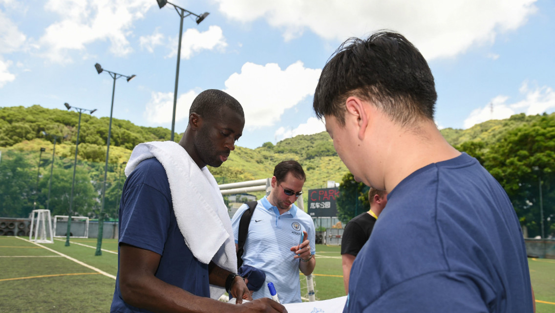 COMMUNITY: Yaya Toure meets participants at the Unified Schools Football Training project in Beijing