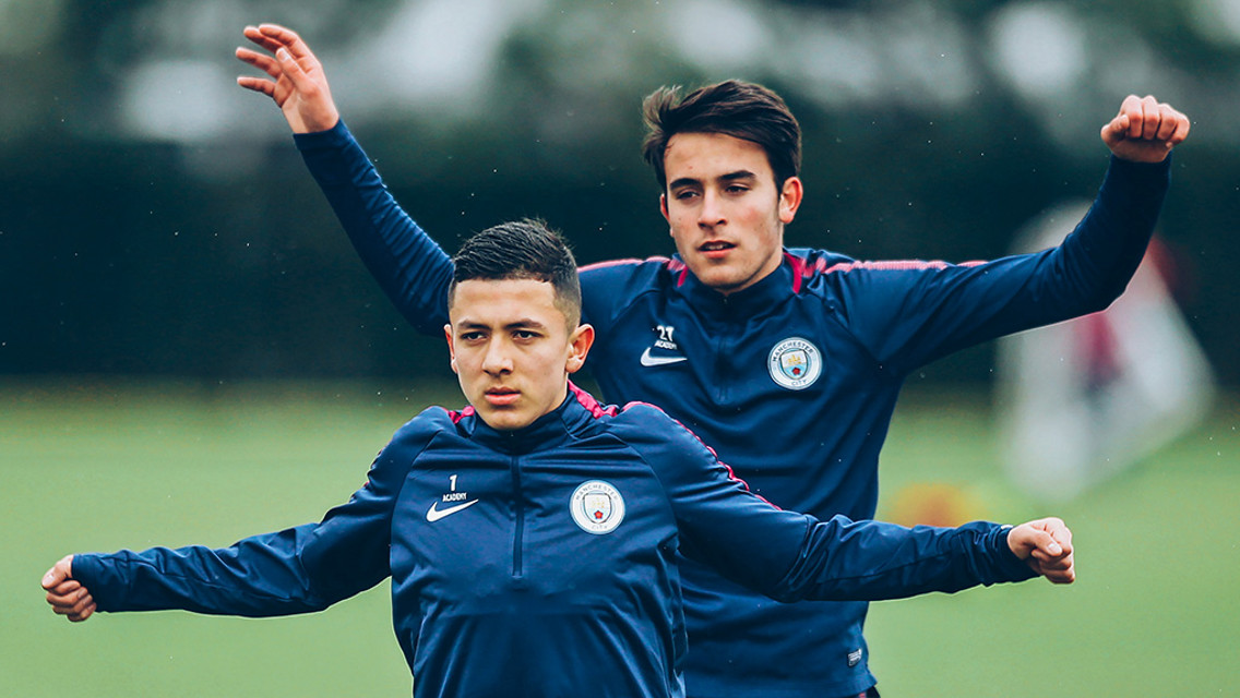 DOUBLE TROUBLE: Ian Poveda and Eric Garcia warm-up on the training pitches.