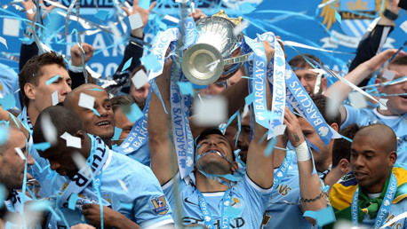 SUCCESS: Sergio lifts his second Premier League title in 2014.