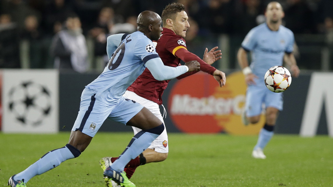 EYES ON THE BALL: Eliaquim Mangala battles with Roma's Francesco Totti in 2014