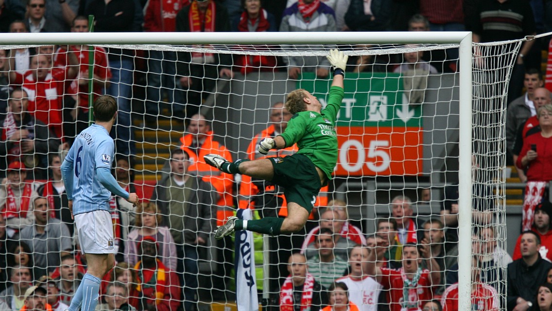 STRIKE A POSE: Hart is frozen in mid-air as he tips a shot over the bar against Liverpool in 2006