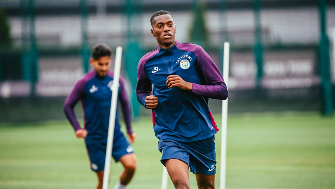 YOUNG GUN: Tosin stretches his legs.