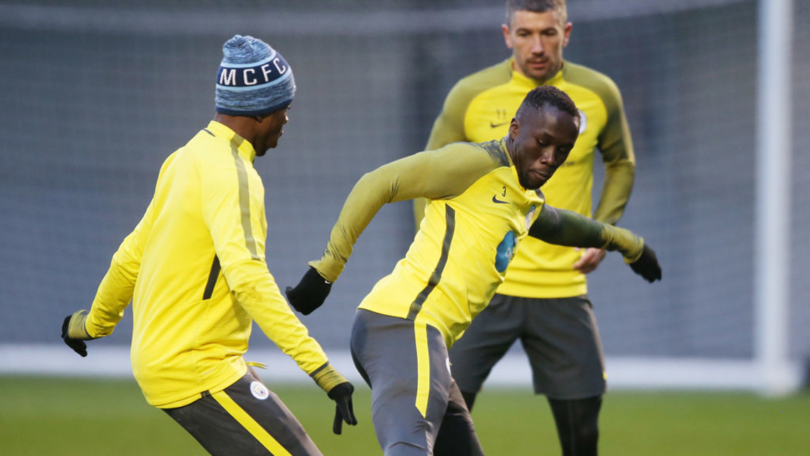BAC AT IT: Sagna battles for the ball.