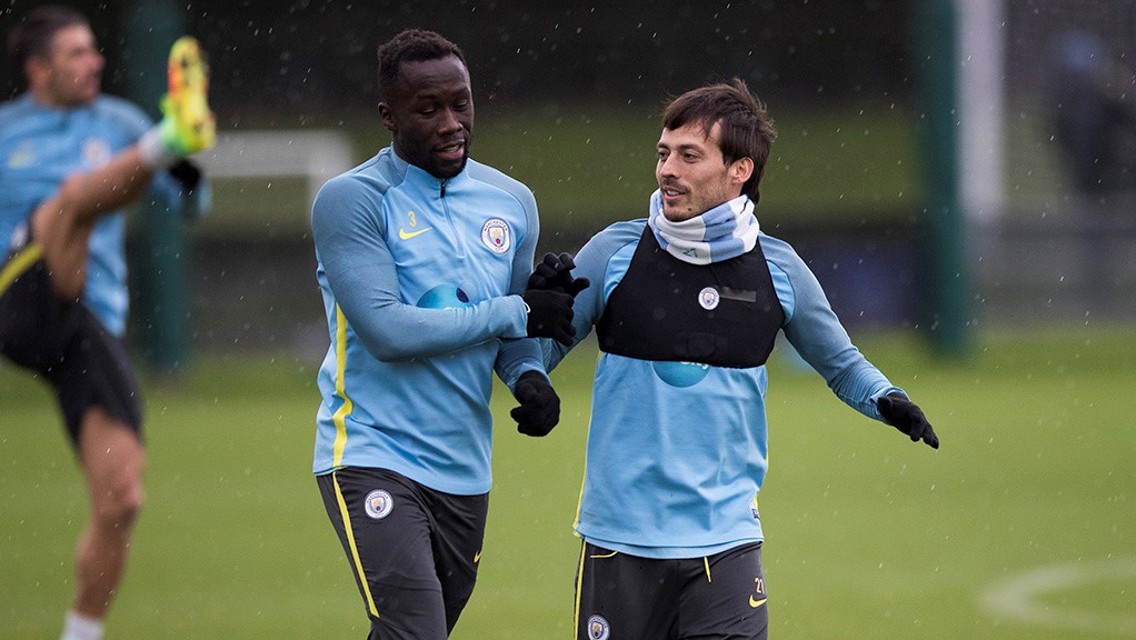 HIGH FIVE: David Silva and Bacary Sagna come together during a training drill