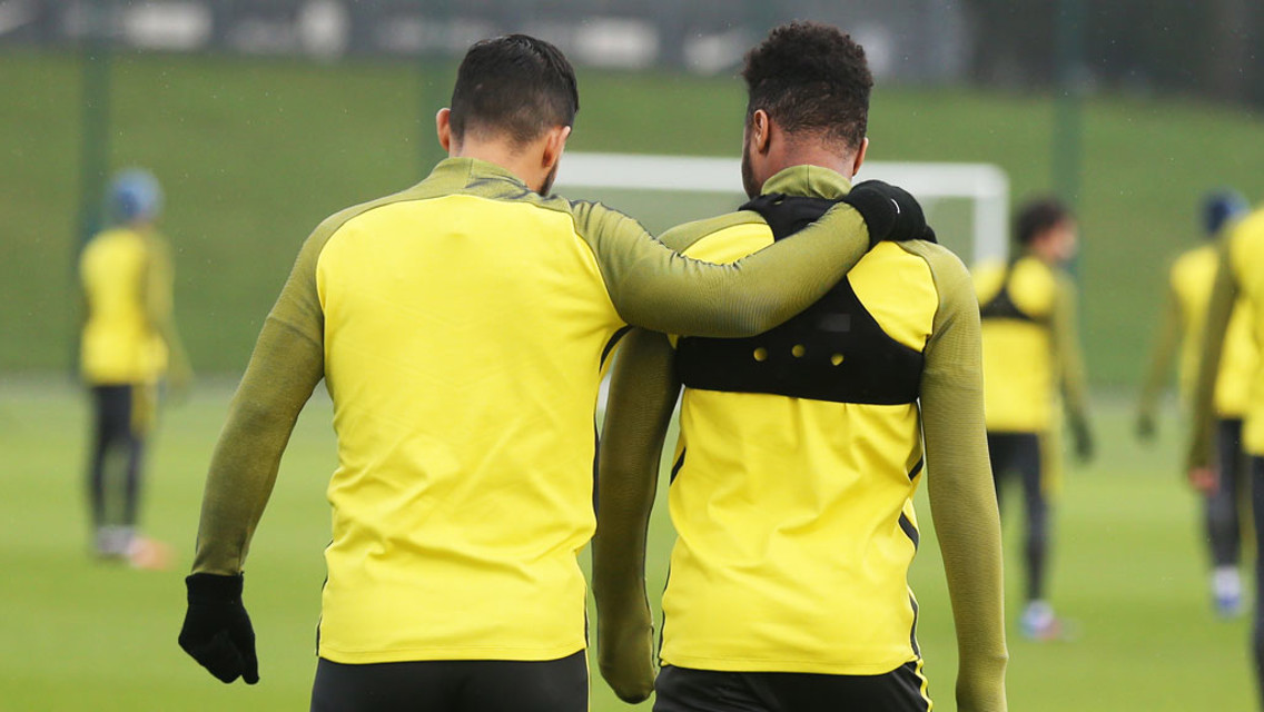 LEARNING FROM THE MASTER: Aguero and Sterling have a chat during the session