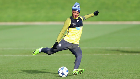 KICK: Raheem Sterling making contact.