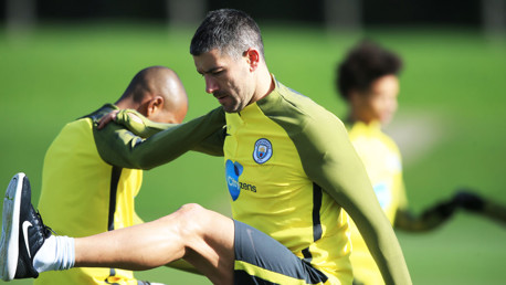SWING: Kolarov stretches out his hamstrings in training.