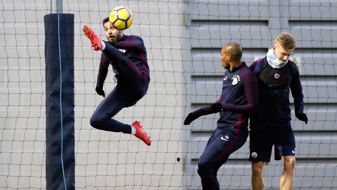 KARATE KICK: Fernandinho looks impressed with Bernardo's skills!