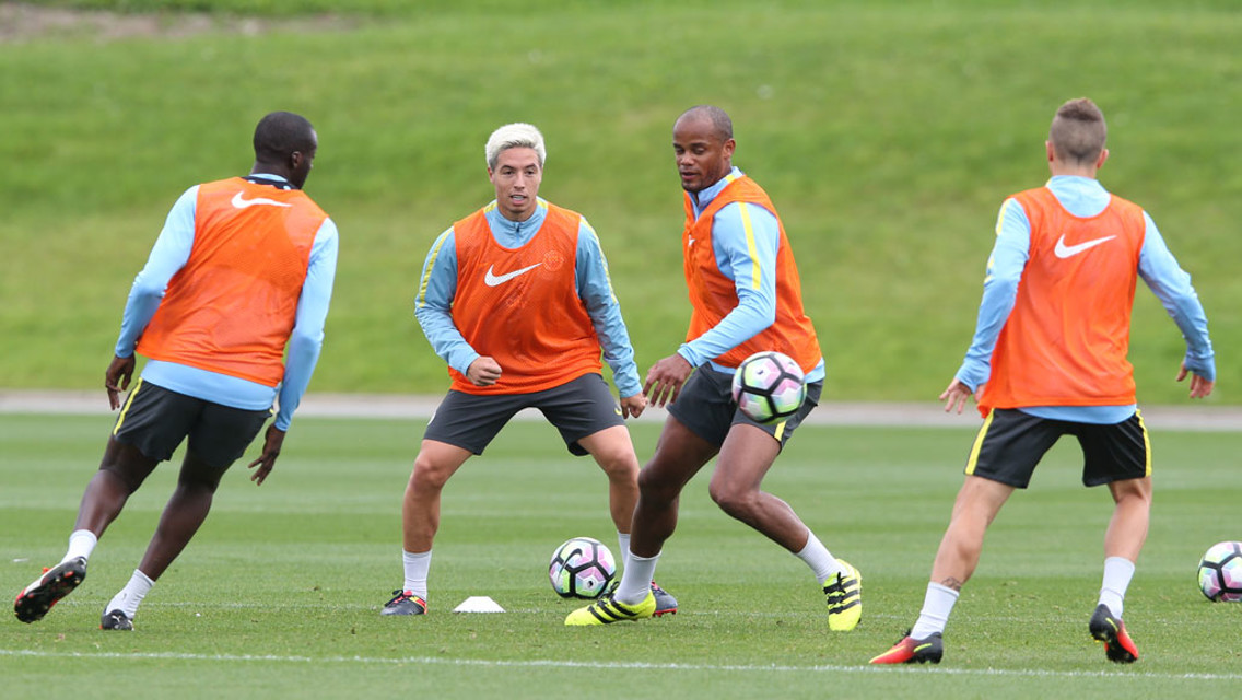 THICK OF IT: Kompany and Nasri in full flow.