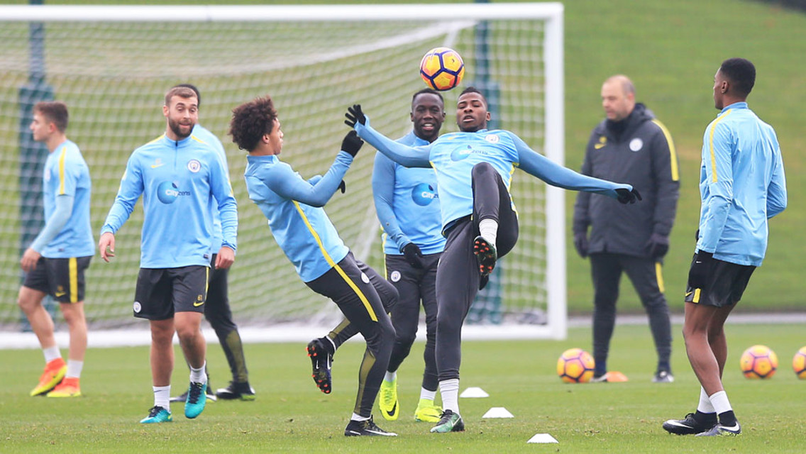 THAT BALL'S MINE: Iheanacho ans Sane fight for the ball.