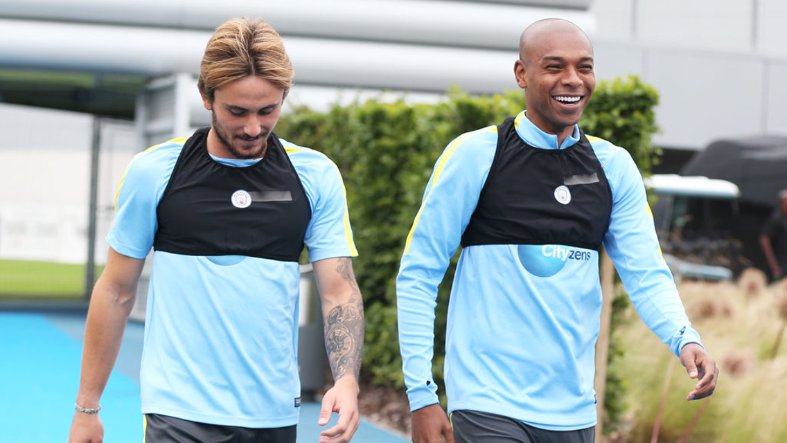 Aleix Garcia and Fernandinho arrive for training.