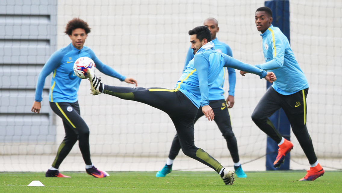 STRETCH: Ilkay reaches for the ball