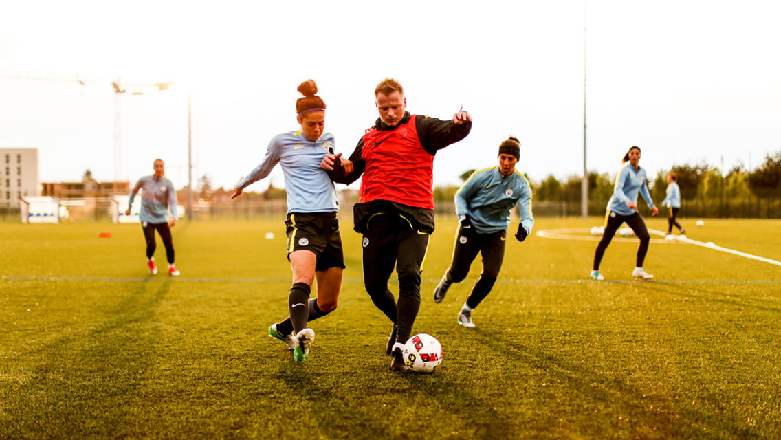 BATTLE: Tessel Middag and assistant coach Alan Mahon tussle for possession