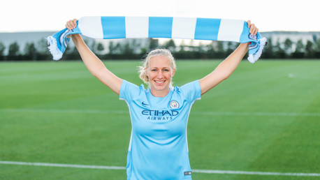 BLUE AND WHITE: Holding the scarf aloft