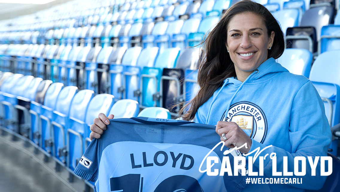 WELCOME CARLI: Carli Lloyd holds up her new shirt, adoring #10