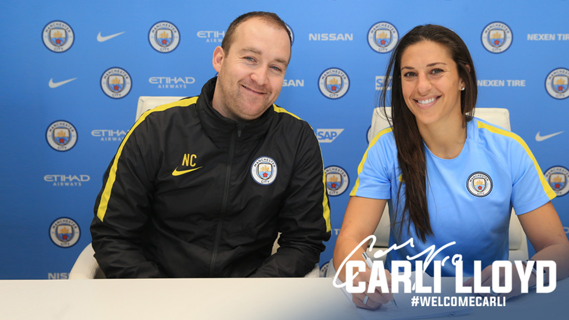 WELCOME CARLI: Carli Lloyd puts pen to paper alongside manager Nick Cushing