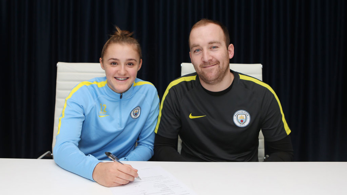 PEN TO PAPER: Georgia Stanway signs her first professional contract, alongside manager Nick Cushing