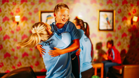 JUNIOR BLUE: The captain congratulates her new teammate
