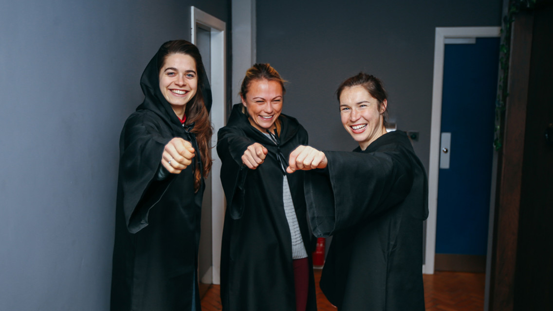 IN THE ZONE: The trio practice their wand-waving skills!