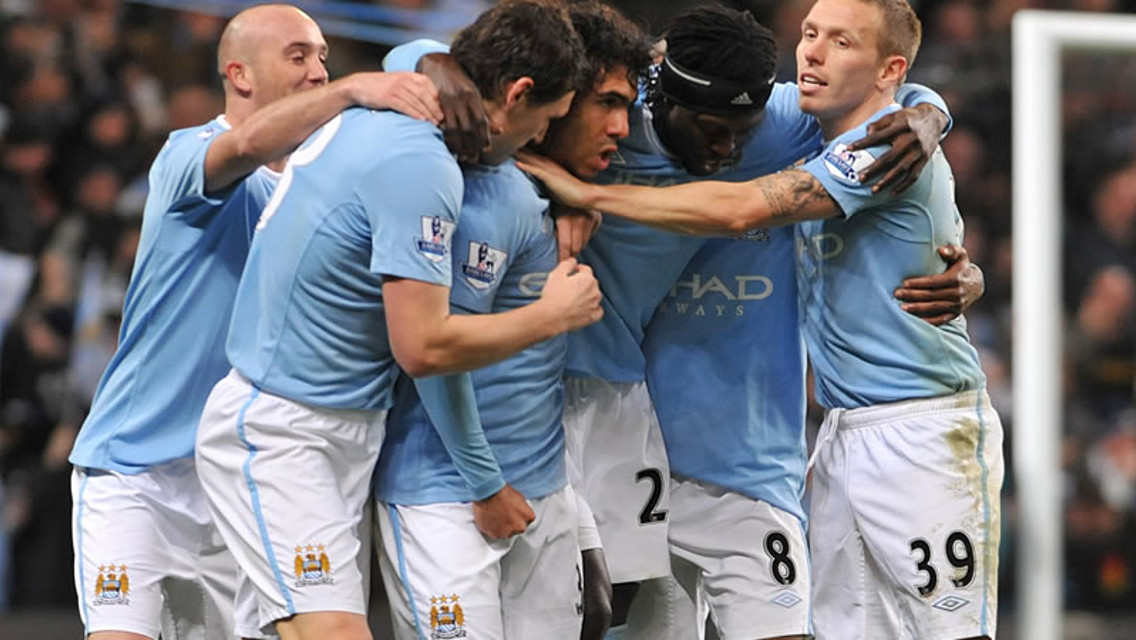 Tevez celebrates with the team