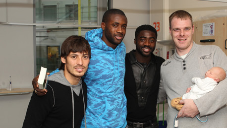 Welcome to the world! A recent arrival meets the Toure brothers and Merlin.