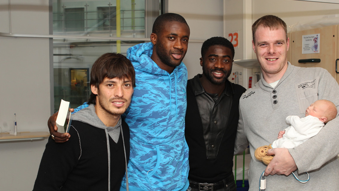 Welcome to the world! A recent arrival meets the Toure brothers and Merlin.