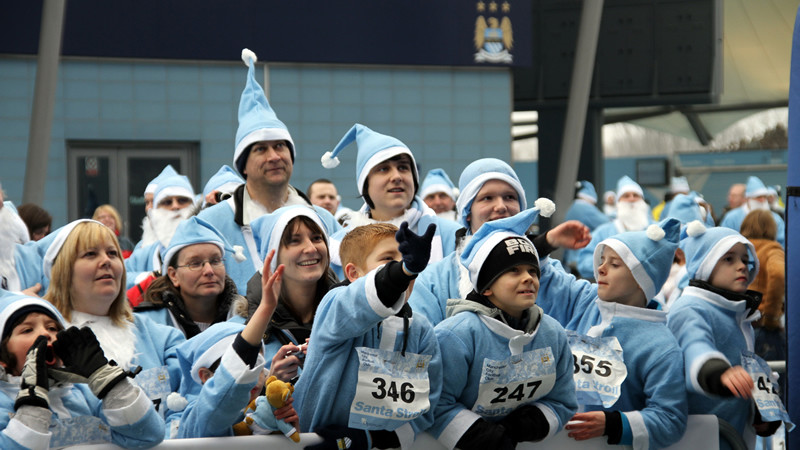 Blue santas a plenty at the city santa stroll