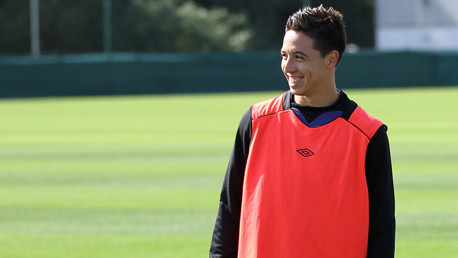 French midfielder in good spirits at training