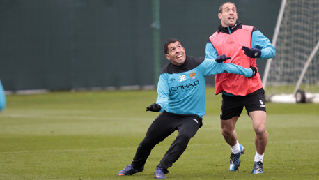 Two whole-hearted competitors, Tevez and Zabaleta, give it their all in a bid to win the ball