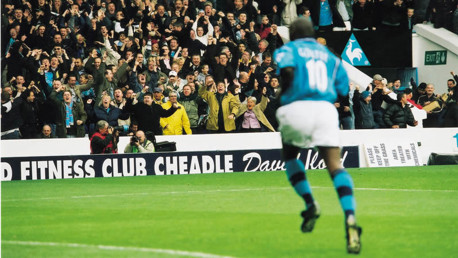 Maine Road explodes after Shaun Goater picks Gary Neville's pocket.