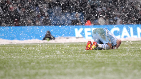 Aleks Kolarov takes the advice of the LED perimeter advertising after a late tackle
