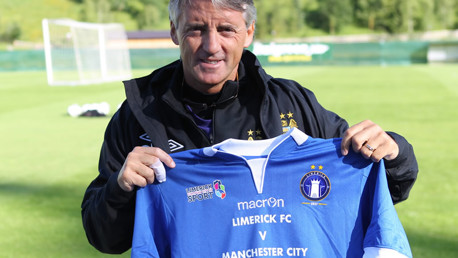Roberto Mancini holding Limerick shirt