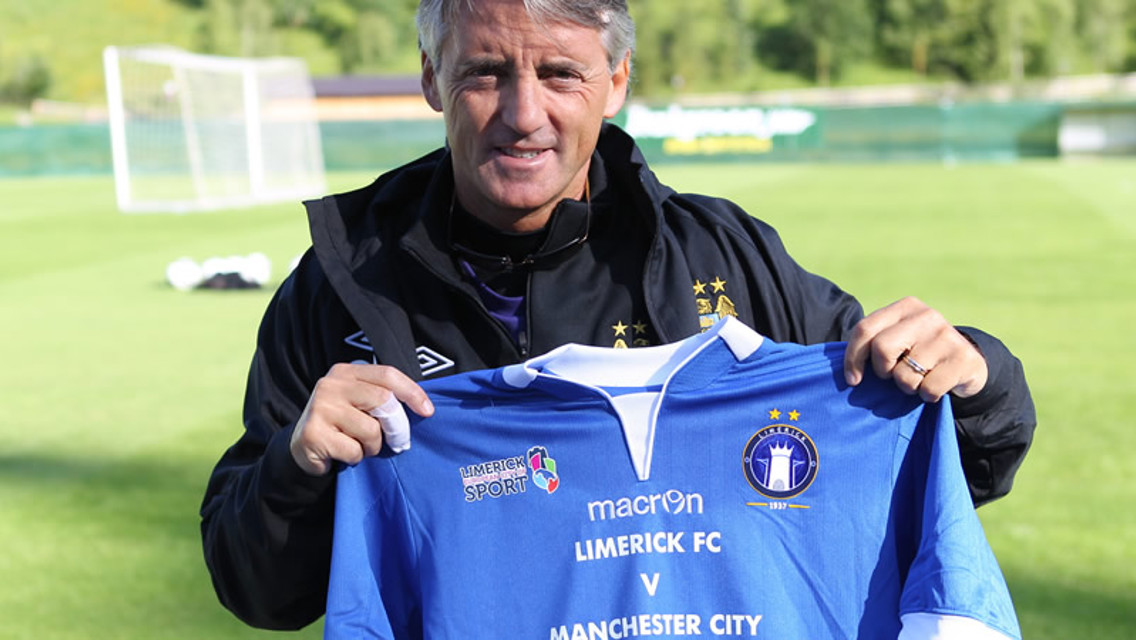 Roberto Mancini holding Limerick shirt