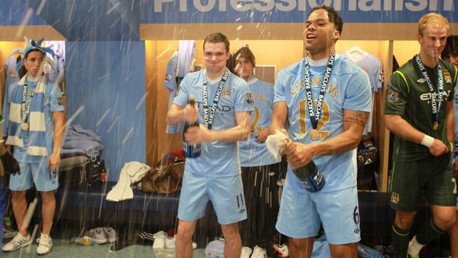 AJ and Joleon commence the soaking of all and sundry with the victory champers.