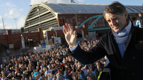 The man of the moment cuts a path through his adoring public.