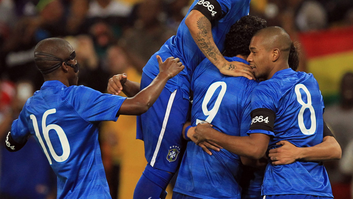 Fernandinho celebrates with his Brazilian teammates in their 5-0 win