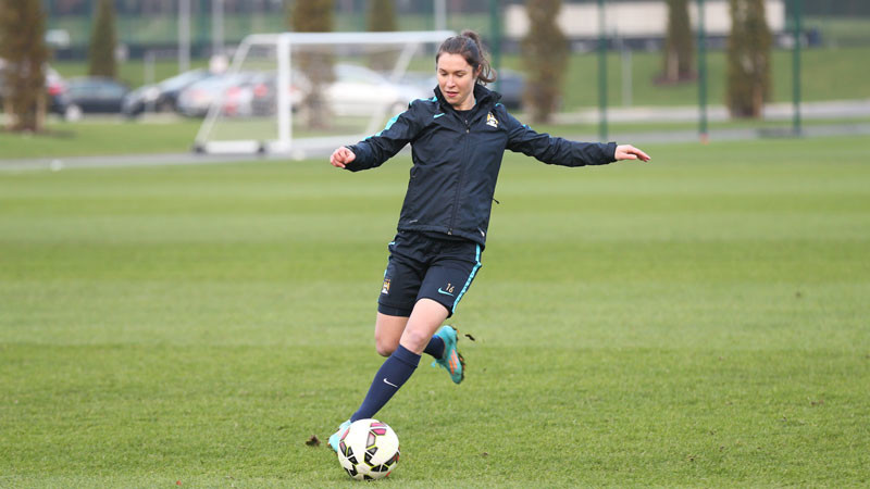 Jane Ross passes the ball in training