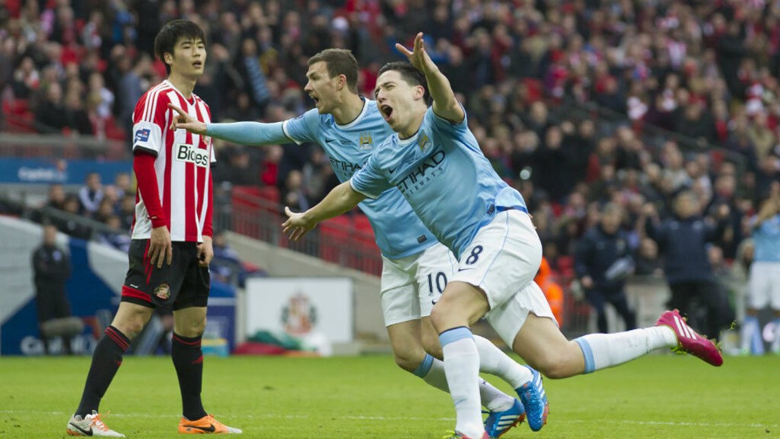 WHEELING AWAY: Nasri celebrates his spectacular goal in the 2014 Capital One Cup final.