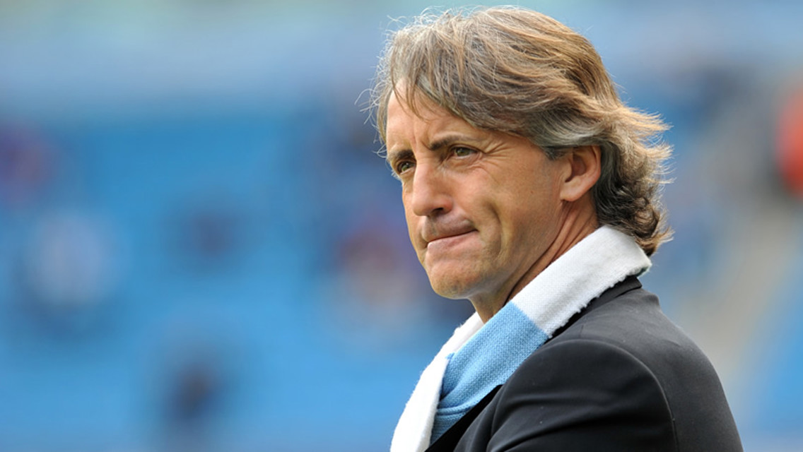 Mancini watches warm up from the touchline