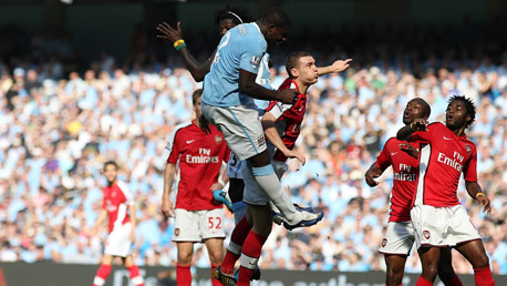 Micah heads goalwards v Arsenal