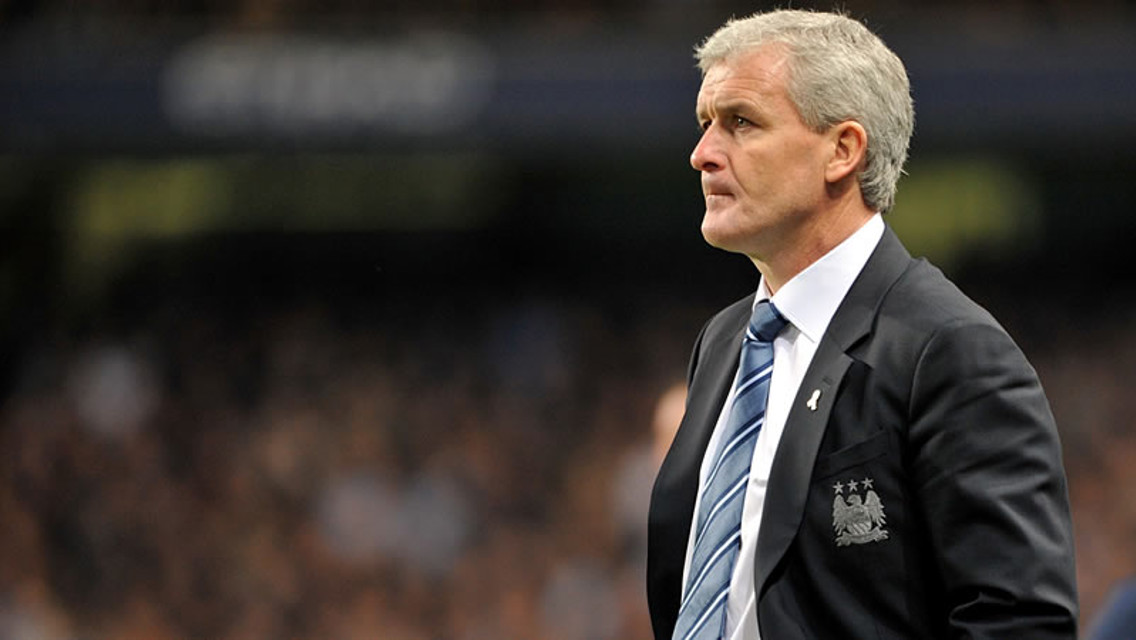 Hughes looks on