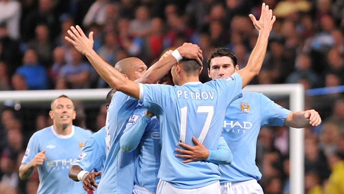 Petrov celebrates the second goal with team mates at City vs West Ham