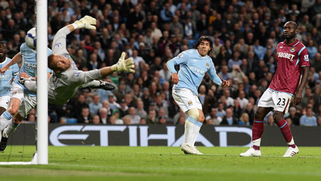 Carlos Tevez scores his second goal of the game