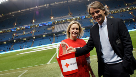 Roberto Mancini donates to Red Cross collection