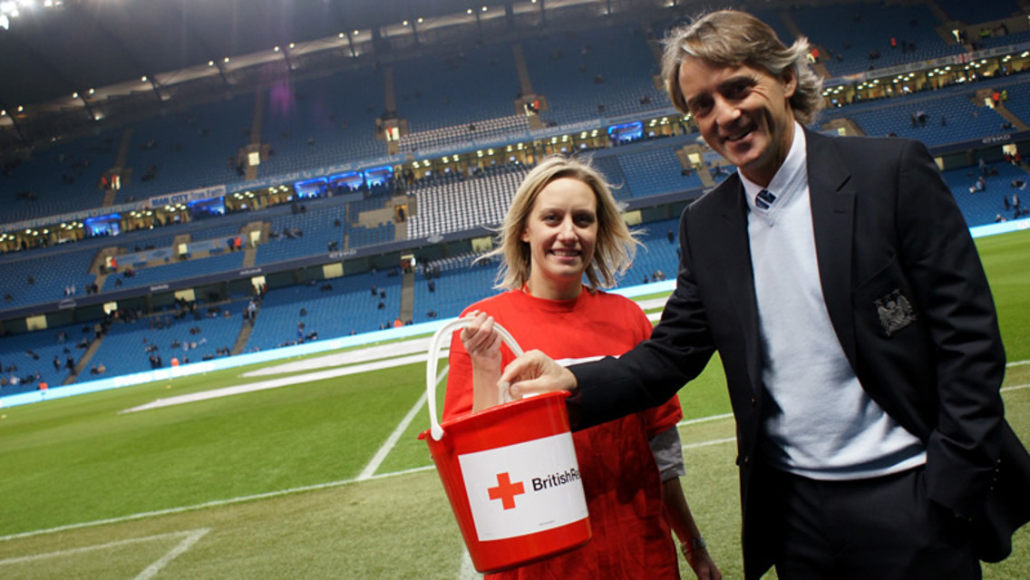 Roberto Mancini donates to Red Cross collection