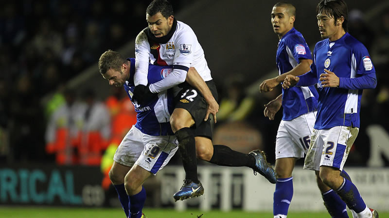Tevez Scrambles for the ball Leicester