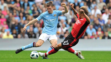 Milner and Salgado battle for the ball