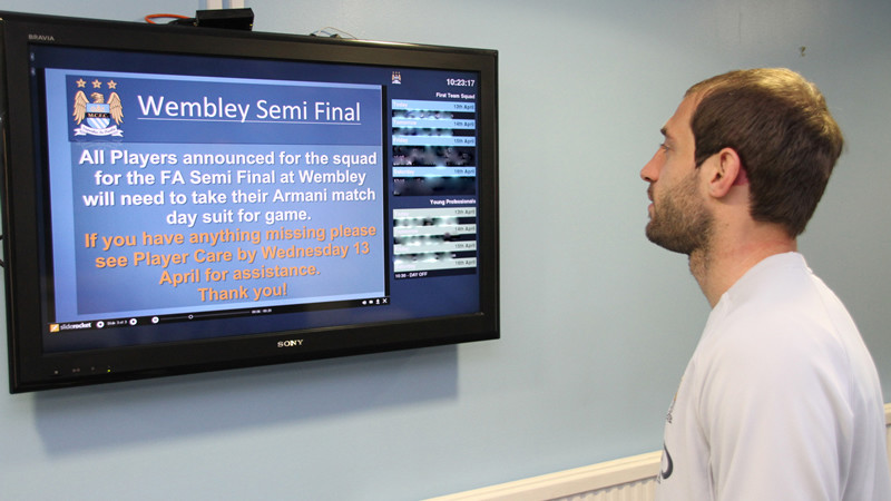 Zabba checks the board for FA cup info